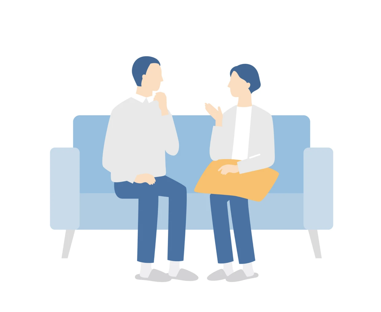 Two people talking on a sofa